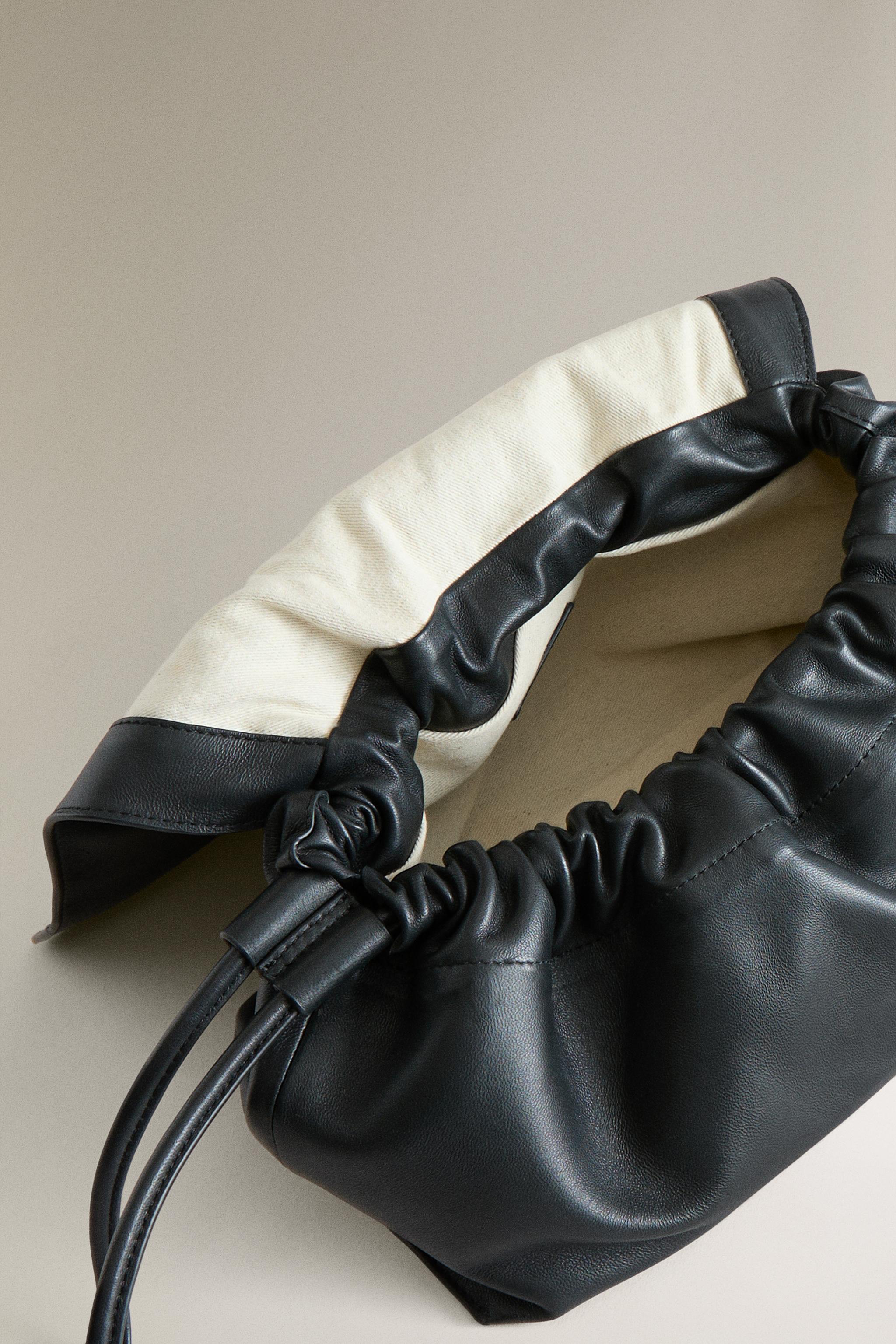 TROUSSE DE TOILETTE POCHETTE CUIR